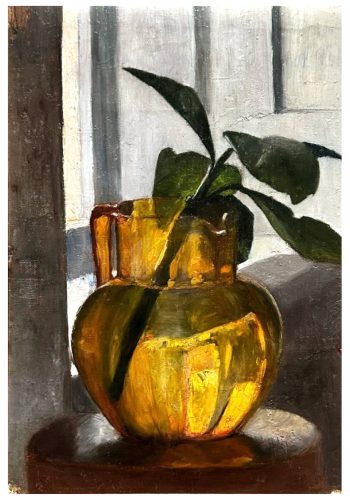 Orange glass jug with green cutting.