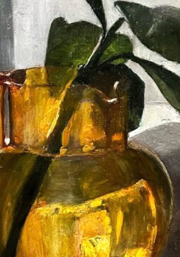 Detail: Orange glass jug with green cutting.
